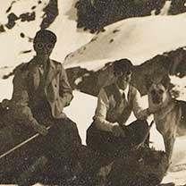 People seated on snowy mountain