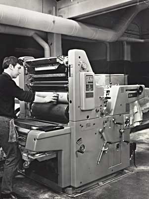 Photo of machine roller with atlas pages on it