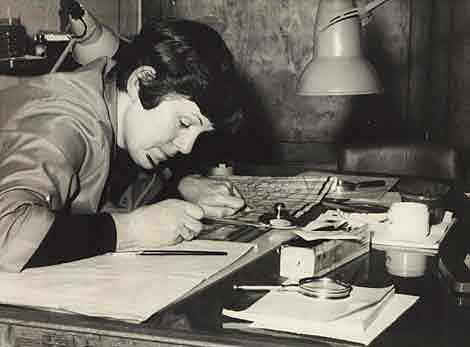 Photo of a woman working on a map