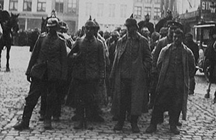 German prisoners in a town square