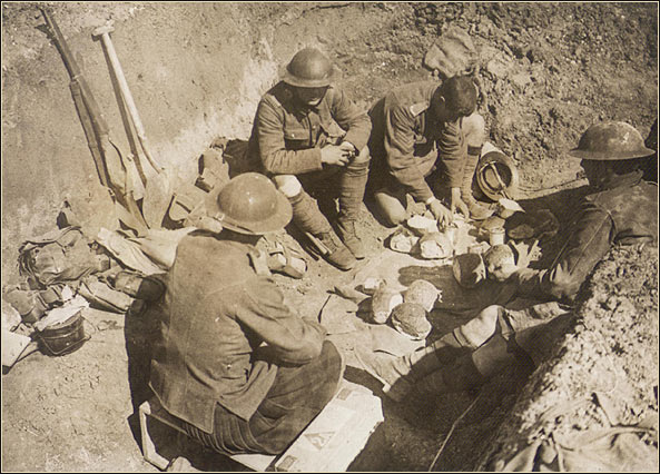 Scottish soliders share rations in a trench