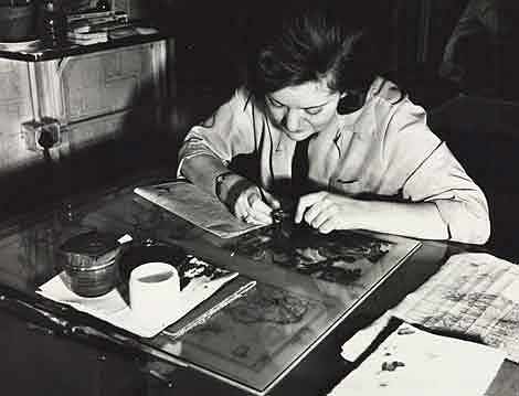 Photo of a woman working on a map