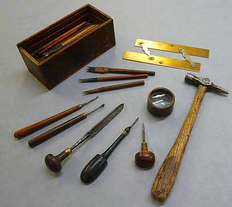 Photo of a box and selection of engraver's tools