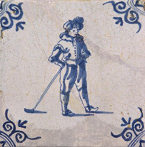 Ceramic tile with golfer and corner ornaments in blue
