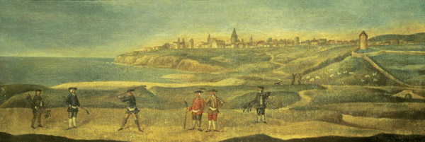 Very wide landscape painting of 4 golfers and 2 caddies on links with sea and St Andrews behind.