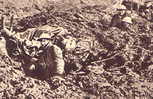 Soldiers in muddy trench