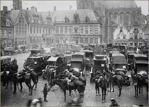 Horses and ambulances in a town square