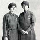 Two women wearing medals