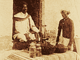 Indian men with table and jars