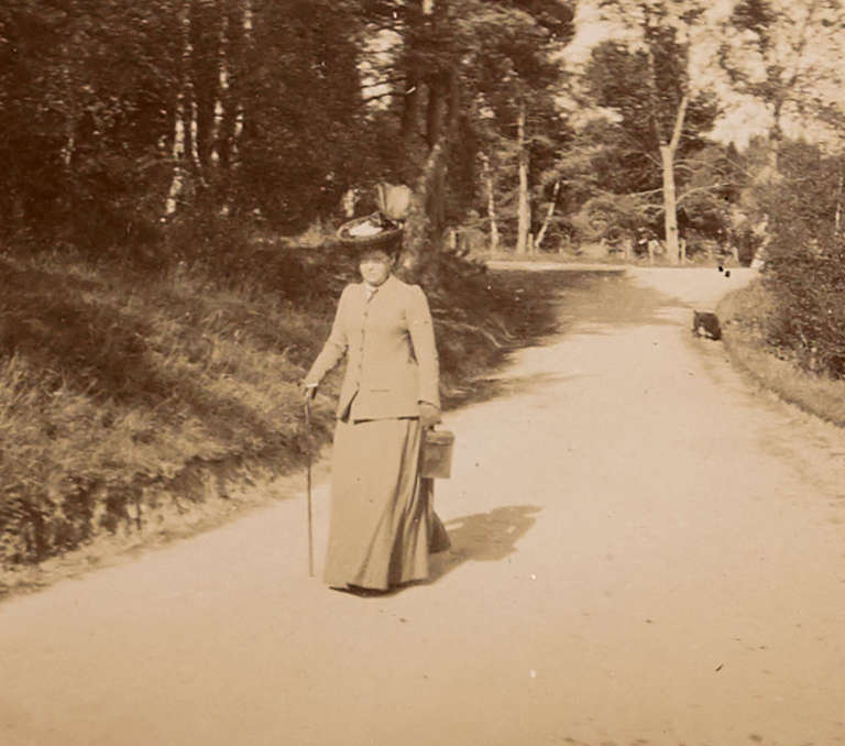 Photograph of woman walking on country lane